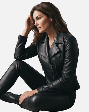 Hilda Leather Lotus black lambskin biker jacket with double side zippers worn by a woman in a studio setting. Antalya, Turkey
