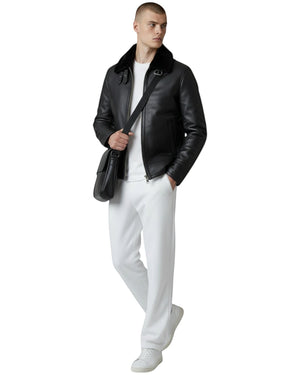 Hilda Leather black leather bomber jacket with shearling collar, zipper closure, and buckle details. Men's outerwear.