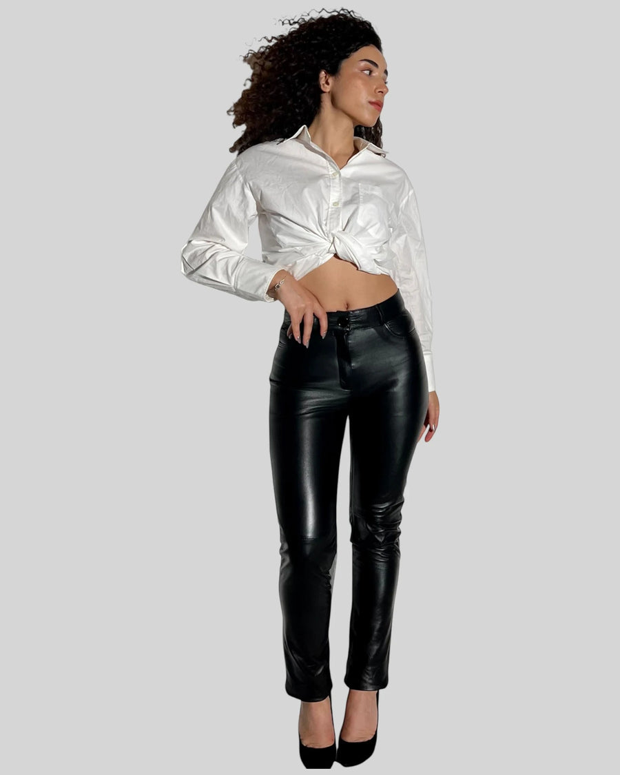 Hilda Leather Aster black lambskin leather pants in a jean style with five pockets worn by a model in a white shirt