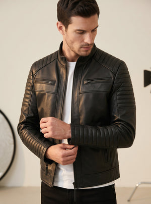 Hilda Leather black lambskin jacket with quilted shoulder and sleeve details, stand-up collar, and zip-front closure.