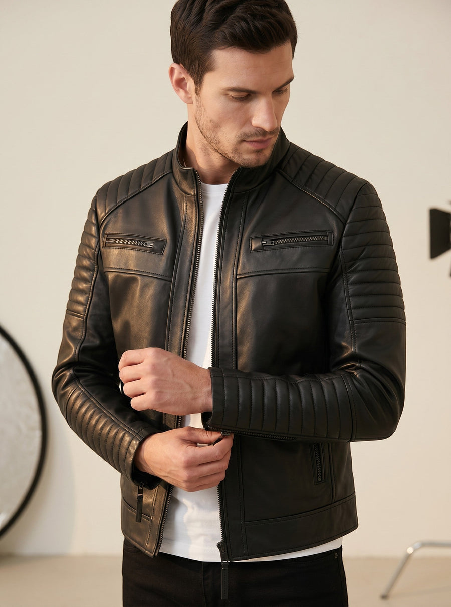 Hilda Leather black lambskin jacket with quilted shoulder and sleeve details, stand-up collar, and zip-front closure.