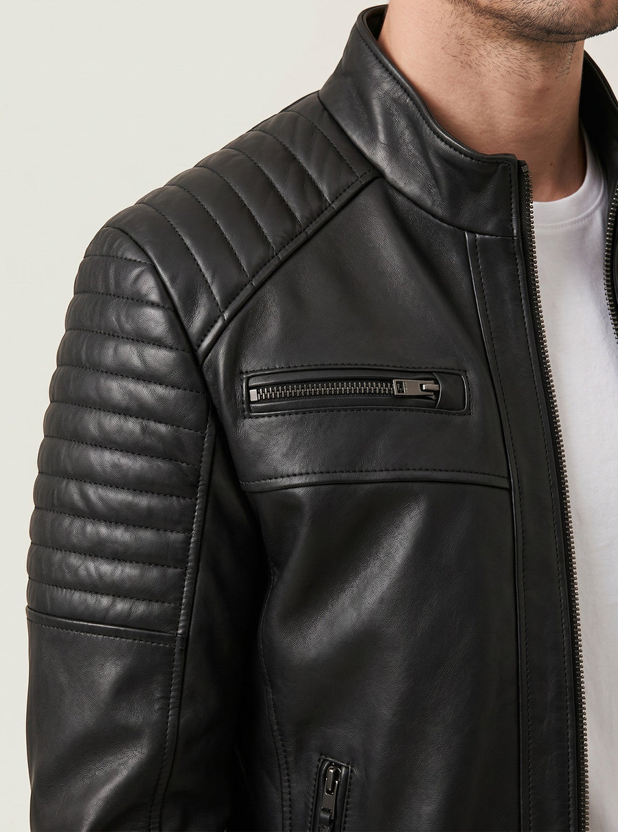 Hilda Leather Brad black lambskin jacket featuring quilted shoulder detailing, stand-up collar, and zip-front closure.