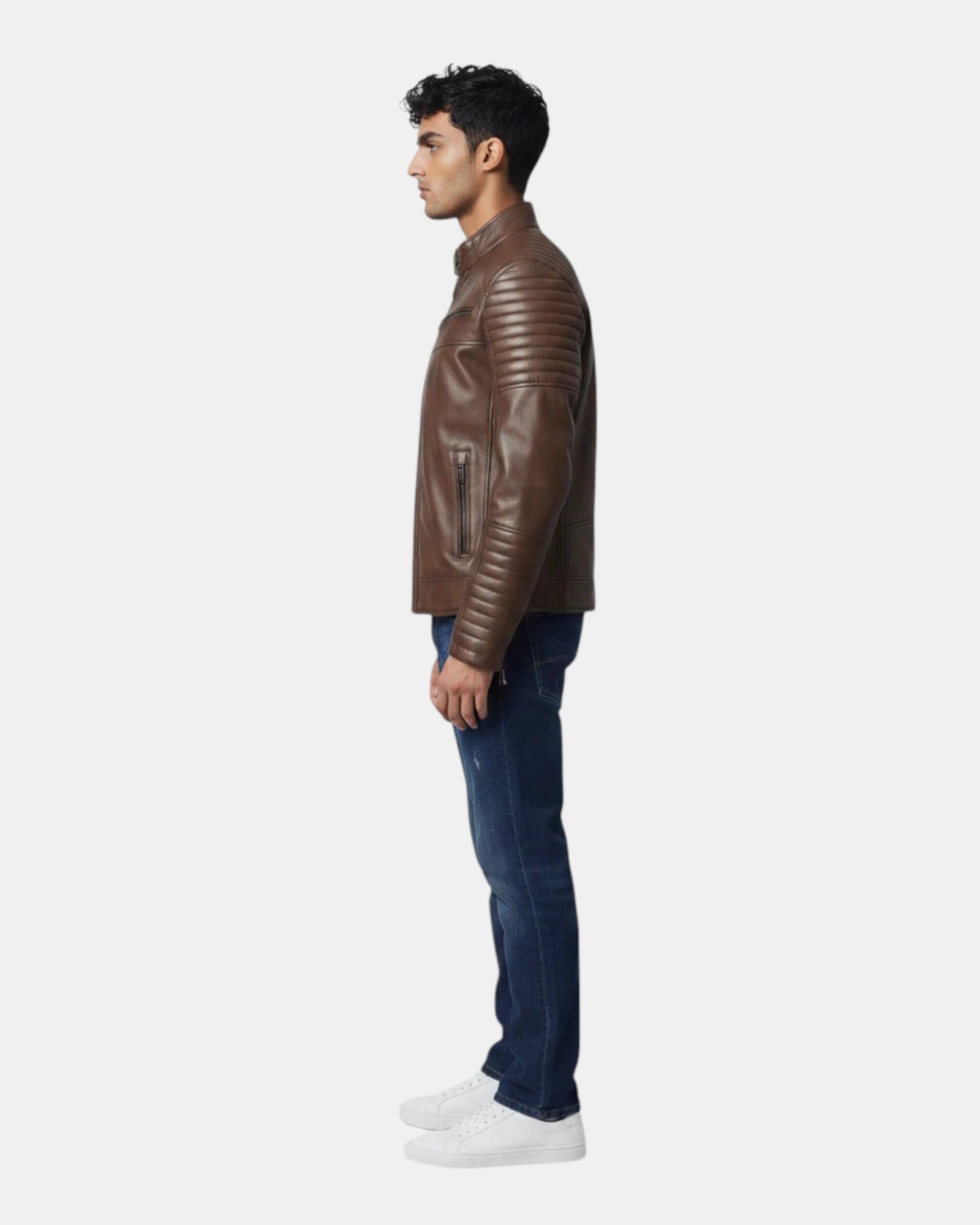 Side view of a man wearing a Hilda Leather brown napa lambskin jacket with quilted shoulder and sleeve detailing.