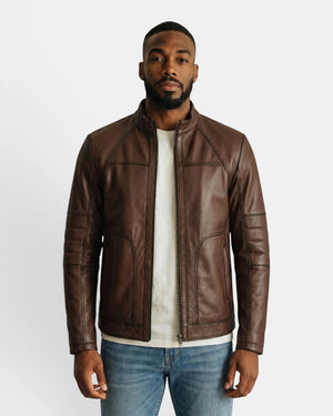 Model wearing a Hilda Leather brown napa lambskin sport jacket with a stand-up collar and zip-front closure.