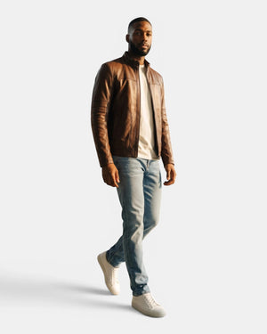 Hilda Leather Thor brown napa lambskin sport jacket worn by a model with jeans and white sneakers