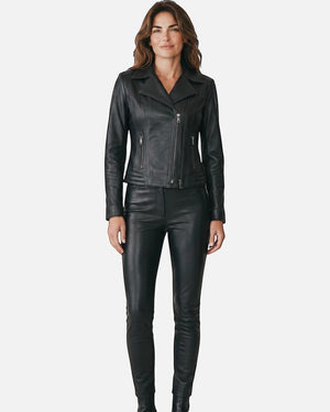 Hilda Leather Lotus black lambskin biker jacket with double side zippers worn by a woman with matching leather pants. Antalya, Turkey