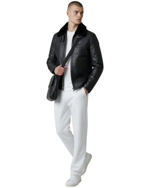 Hilda Leather black leather bomber jacket with shearling collar, zipper closure, and buckle details. Men's outerwear.