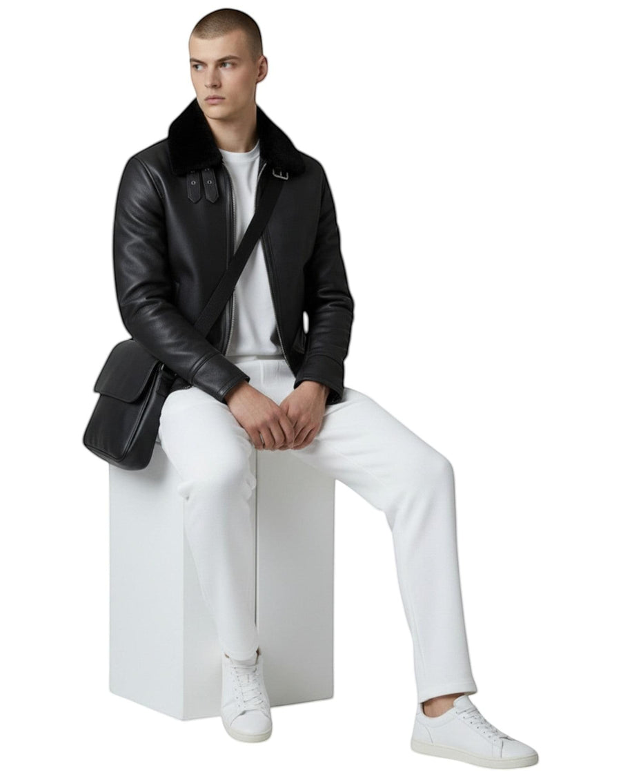 Hilda Leather black leather bomber jacket with shearling collar and buckle details. Classic fit, zip closure.